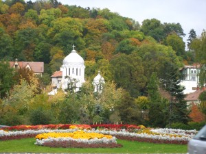 Pretty garden with a Romanian Orthodox Church